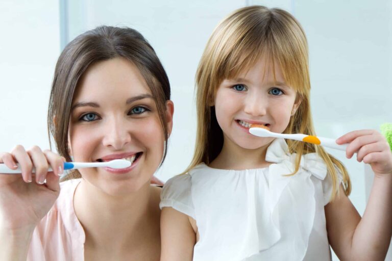 mother-daughter-brushing-teeth-bathroom (1)